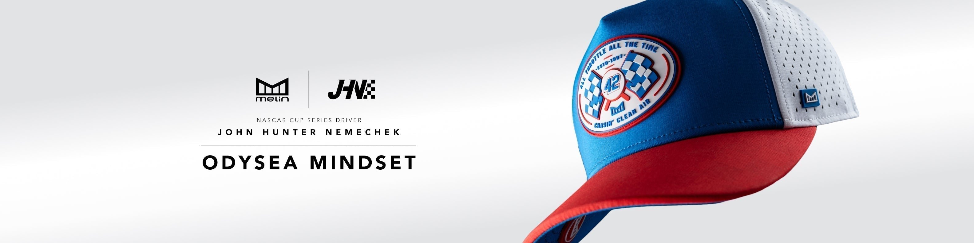A blue and red cap featuring an emblem, with text promoting "Odysea Mindset" and logos of sponsors, including John Hunter Nemechek and melin.