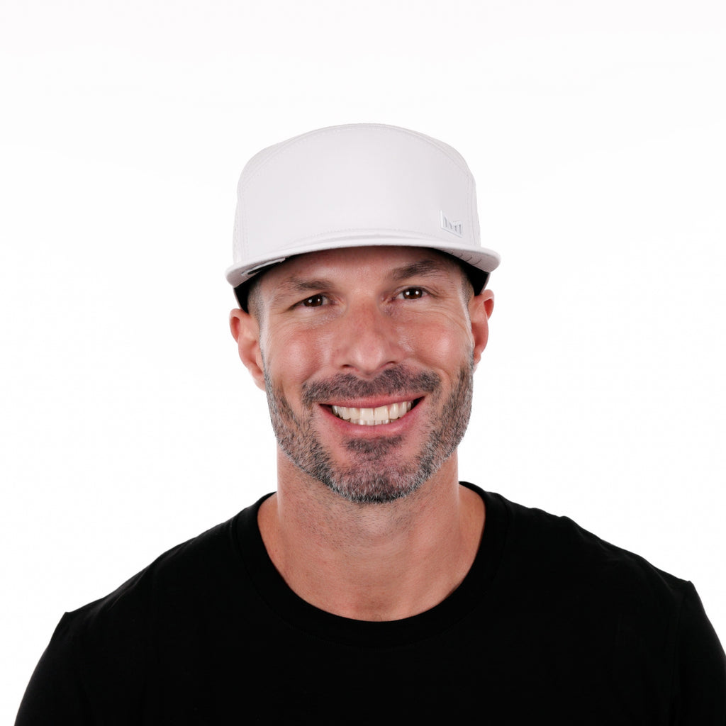 The model view of the Melin Horizon Fit Trenches Icon Hydro hat in white Big Image - 2