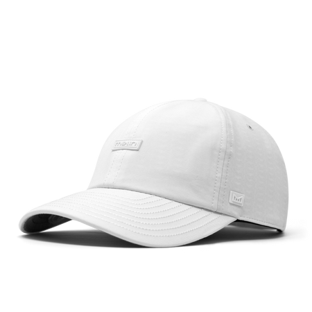 The front, angled view of the melin The Legend Hydro  Performance Dad Hat in  White