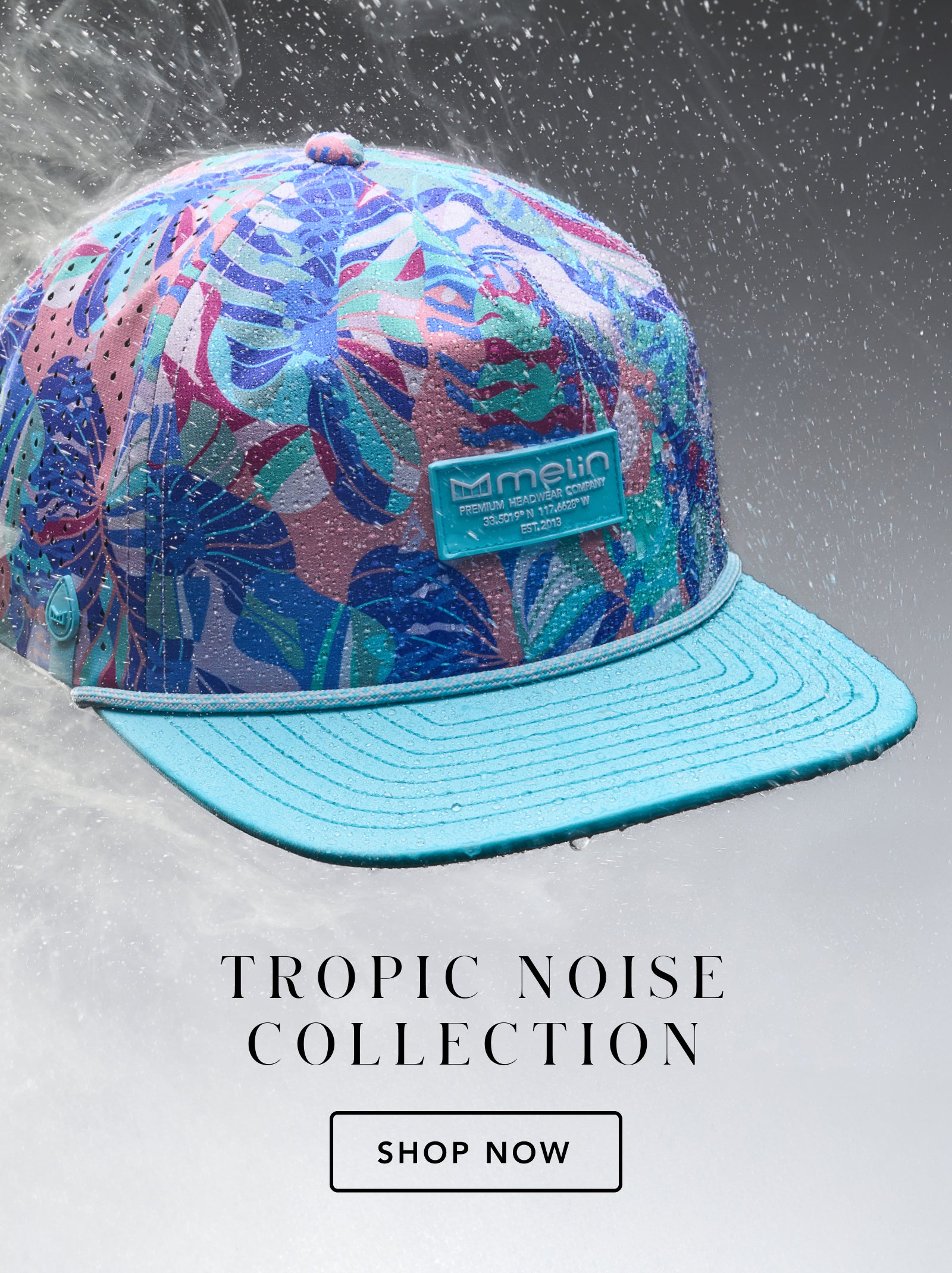 Colorful cap with tropical leaf pattern on a gray background, featuring the melin brand.