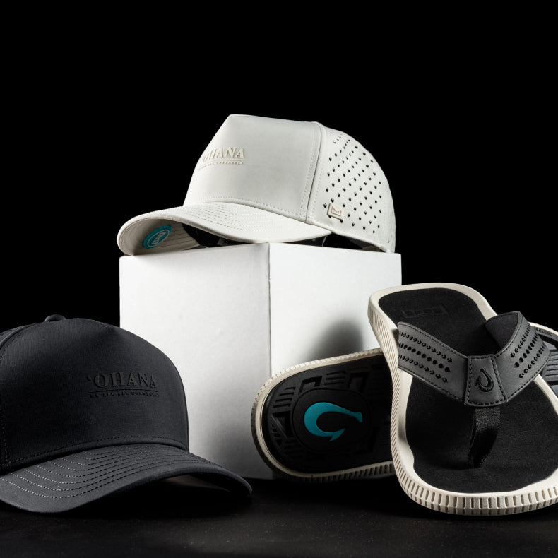 Two melin hats and a pair of OluKai sandals with brandd logo on a black background