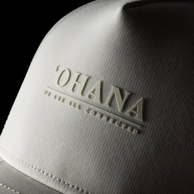 White melin hat with 'OHANA' logo on a black background
