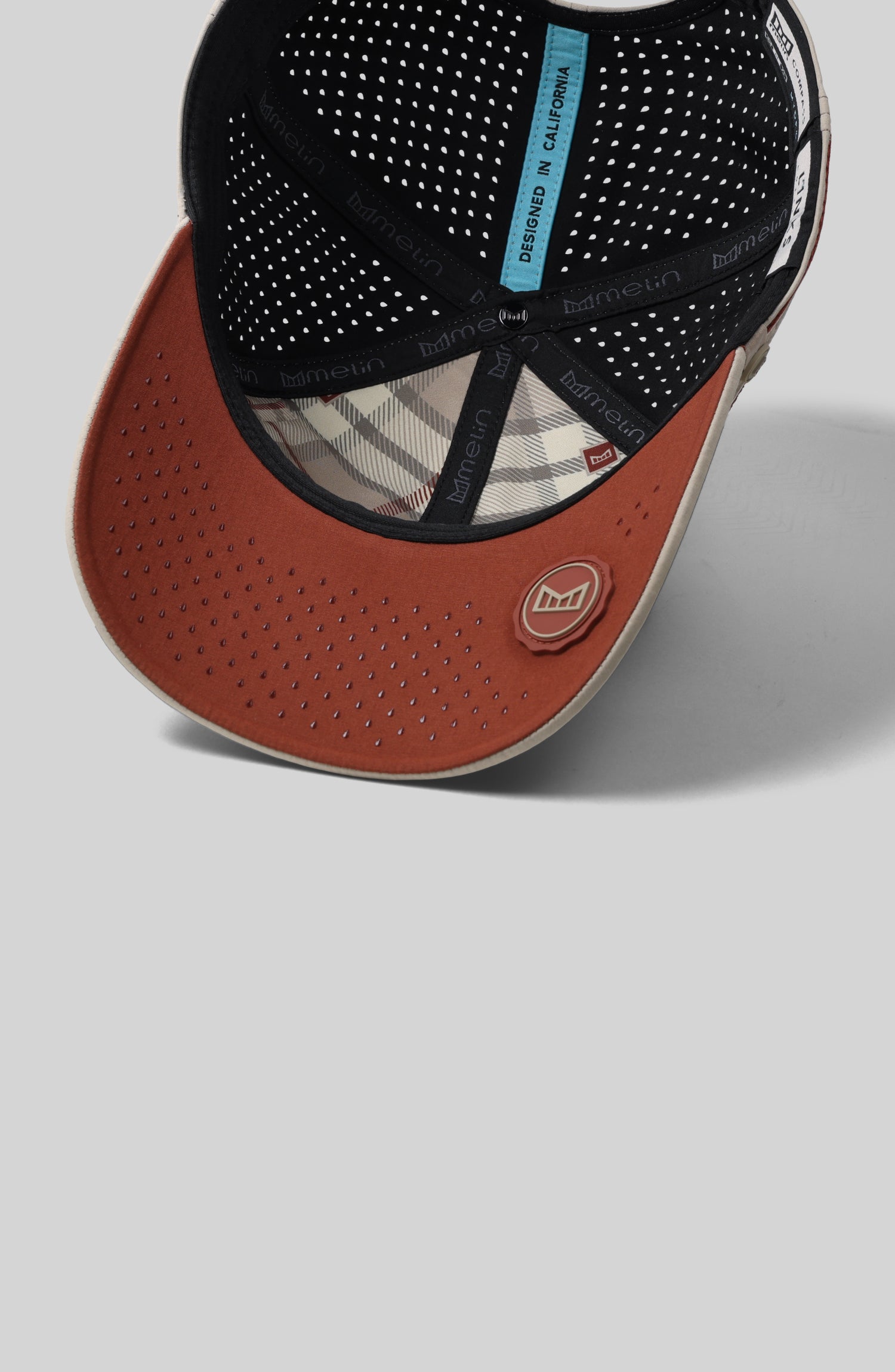 A feature card image for the melin Compass Links Hydro hat in cobblestone (Details)