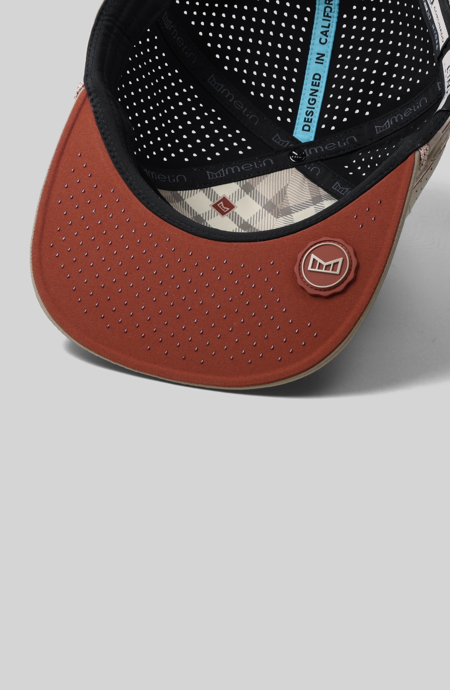 A feature card image for the melin Coronado Links Hydro hat in cobblestone (Details)