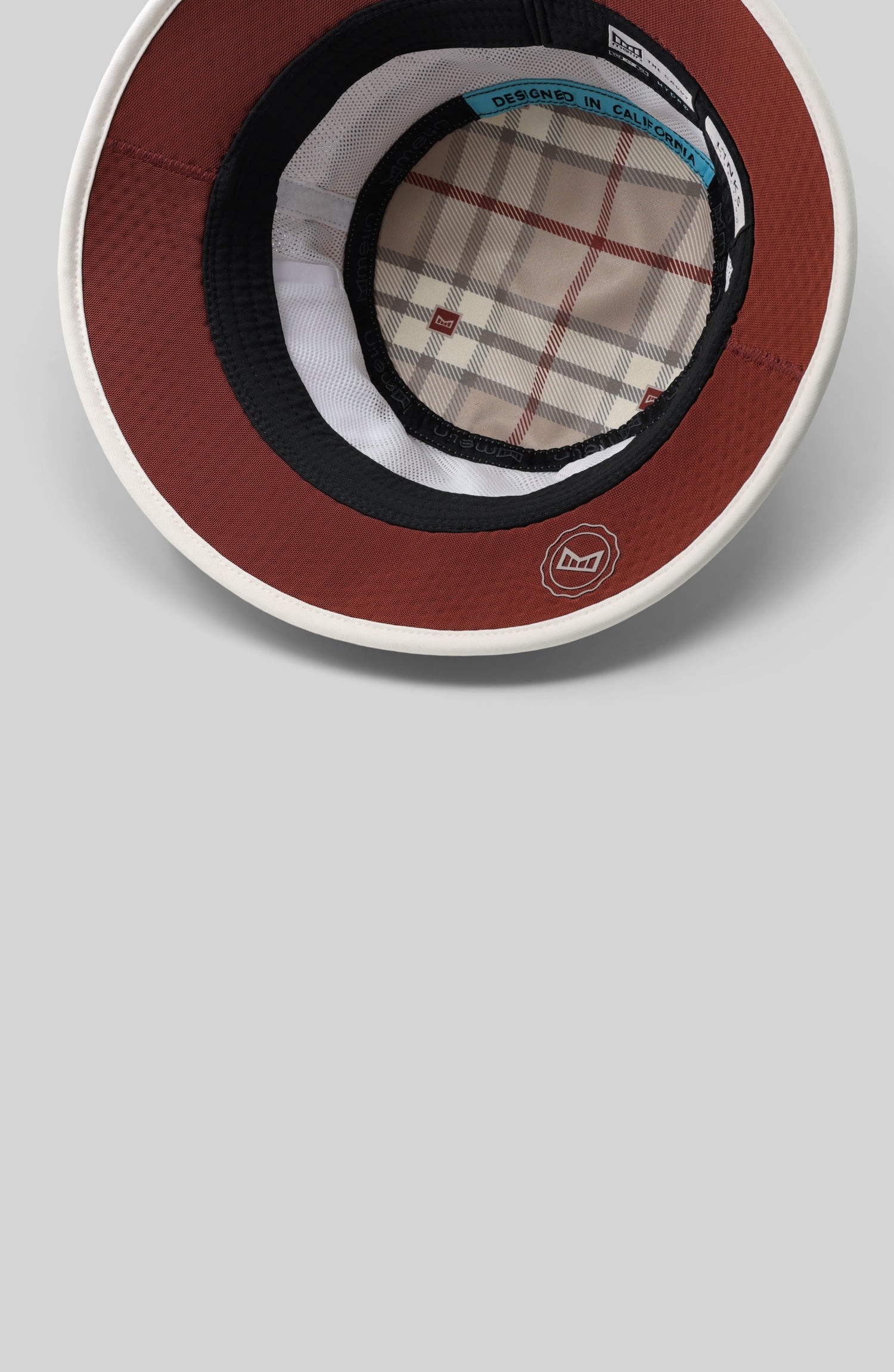 A feature card image for the melin Caddy Links Hydro hat in cobblestone (Details)