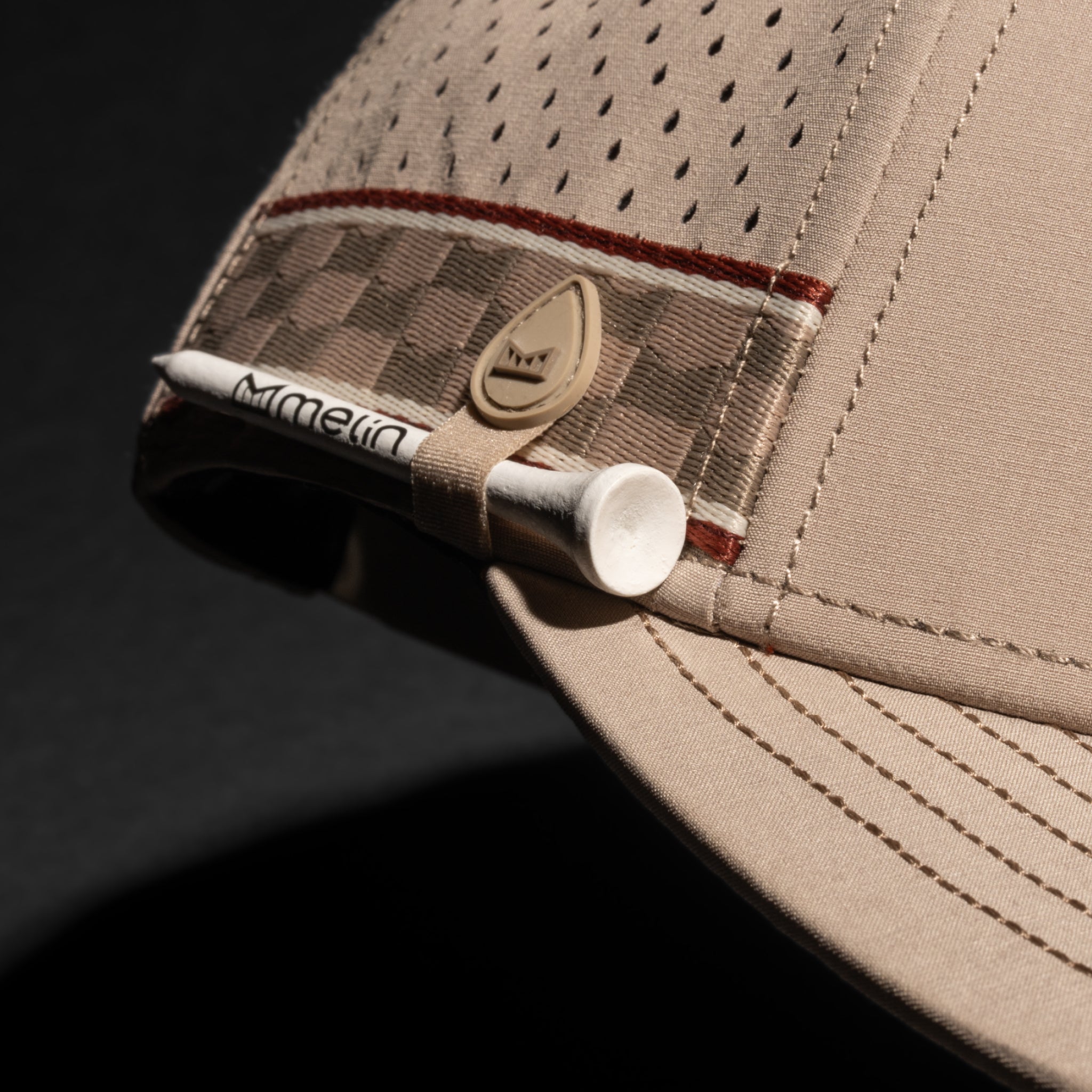 A gallery image of the melin Compass Links Hydro hat in cobblestone, 2 of 5