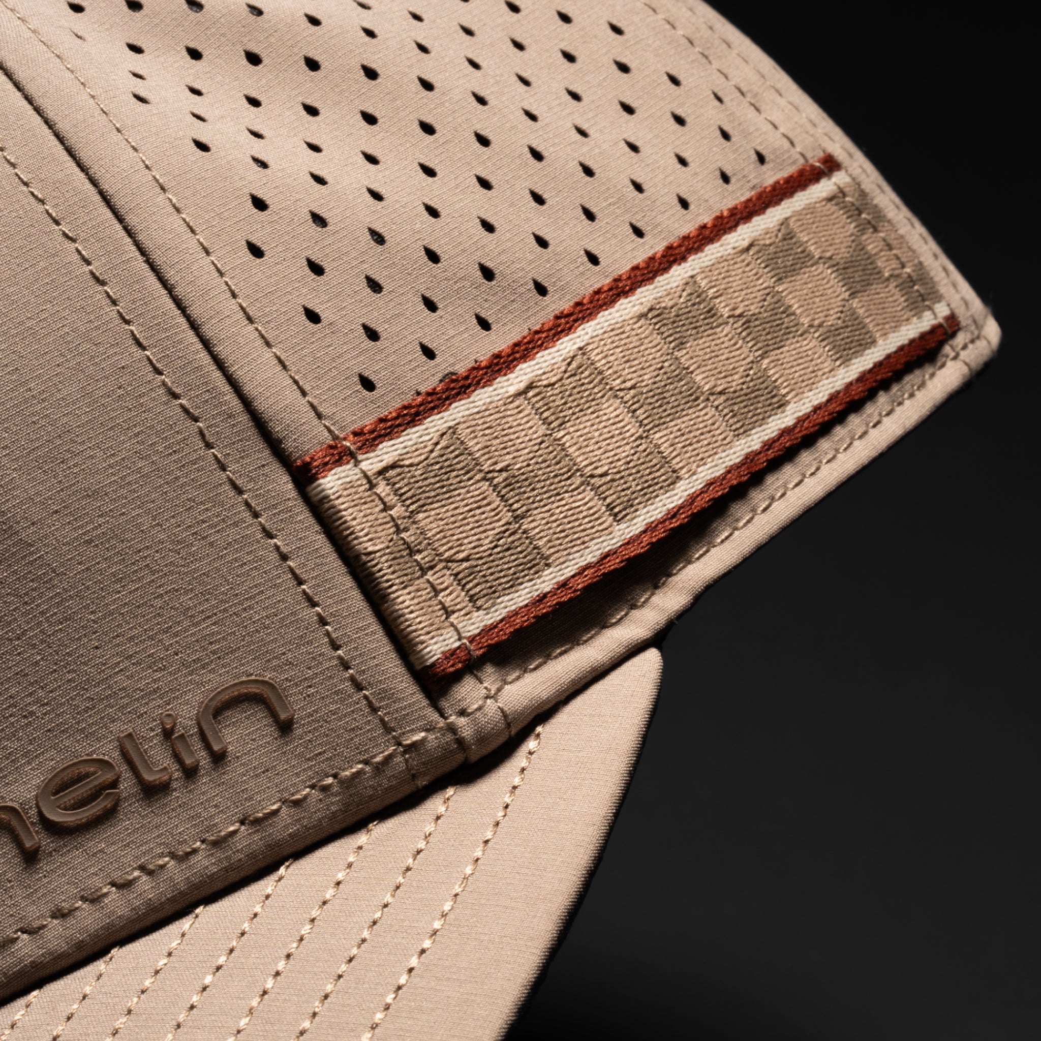 A gallery image of the melin Compass Links Hydro hat in cobblestone, 4 of 5