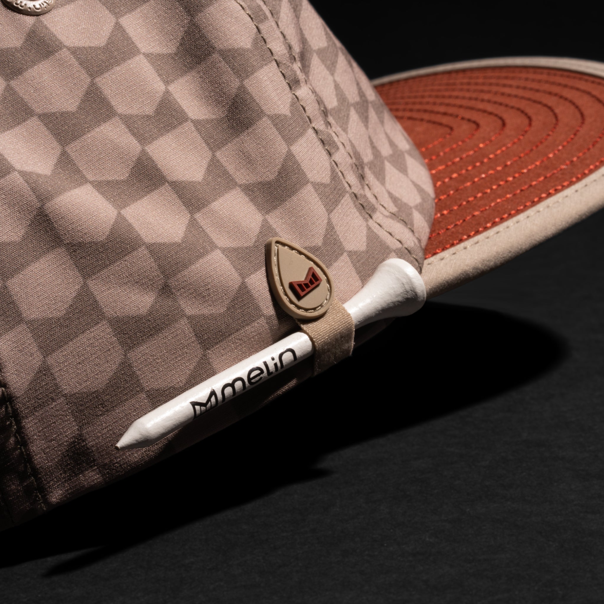 A gallery image of the melin Eagle Links Hydro hat in cobblestone, 2 of 5