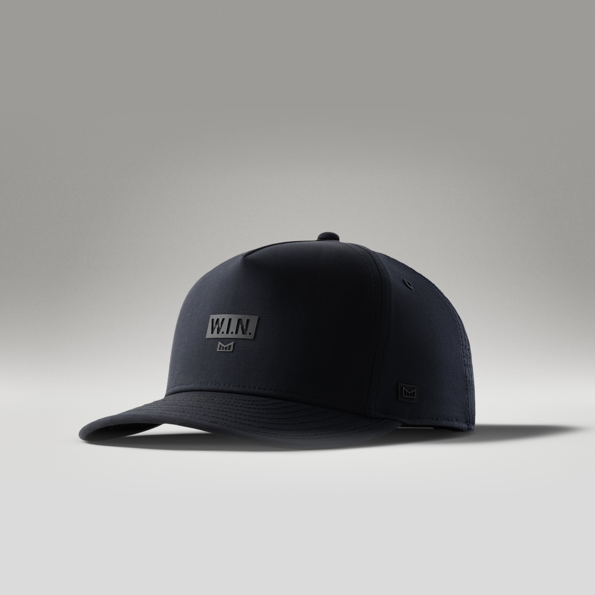The lifestyle image of the melin Split Fit Odysea W.I.N. Hydro hat in black