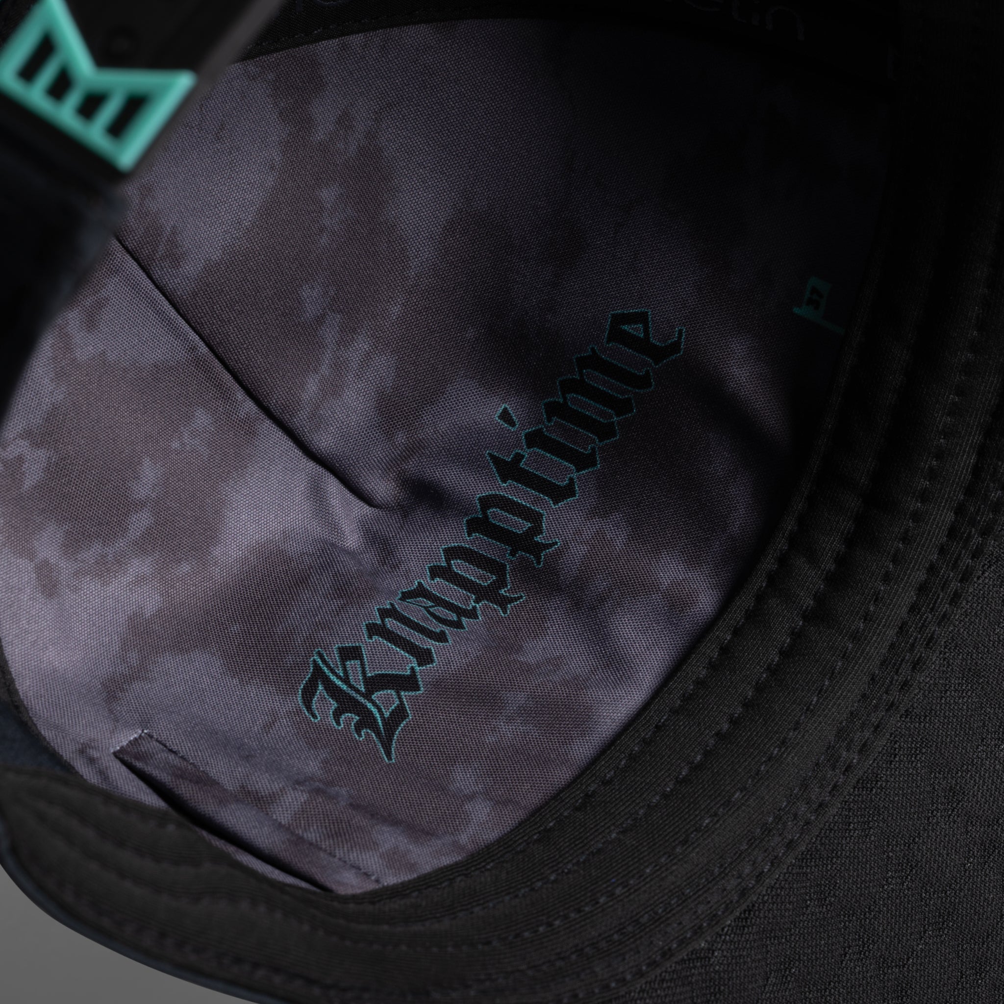 The lifestyle image of the melin Split Fit Odysea W.I.N. Hydro hat in black