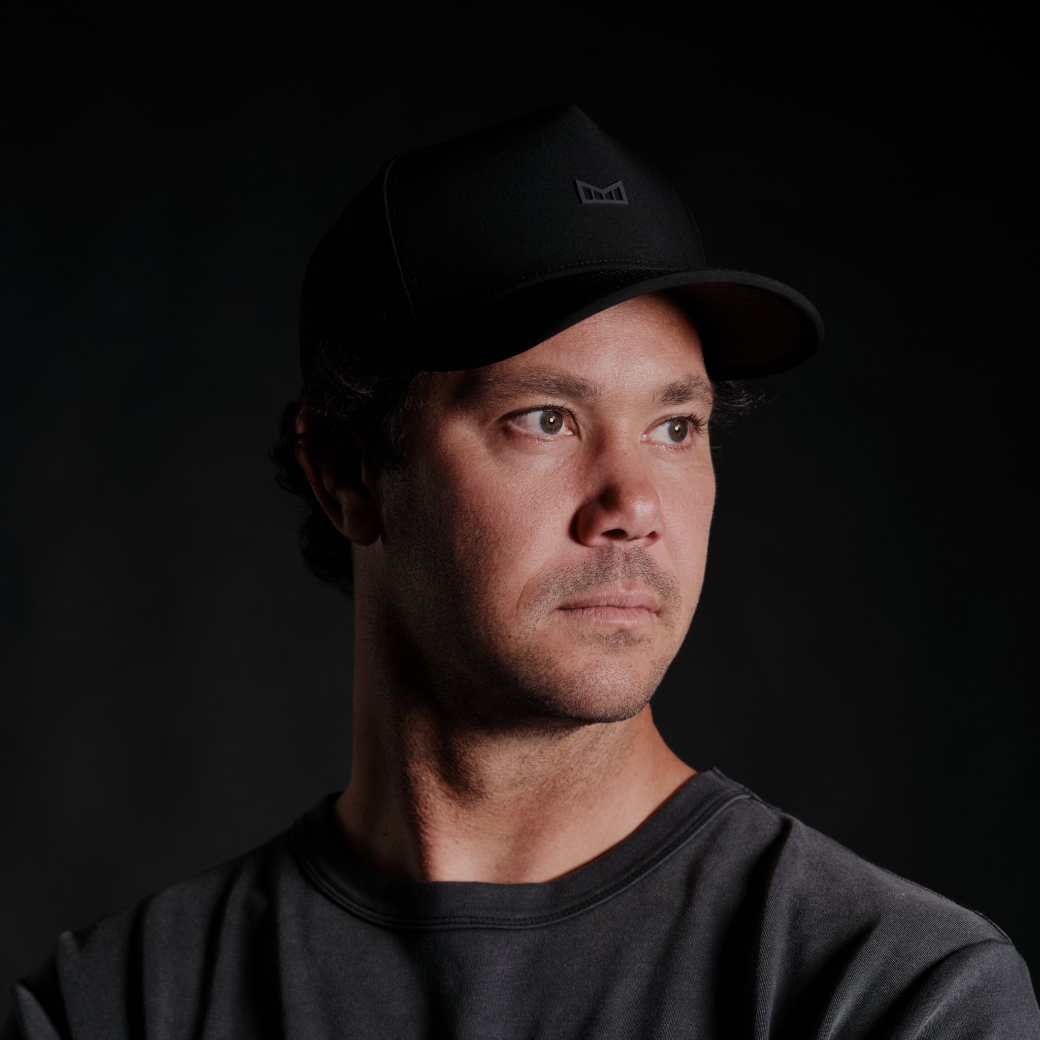 The model-image view of the melin Split Fit Odysea Showing Up Hydro hat in black