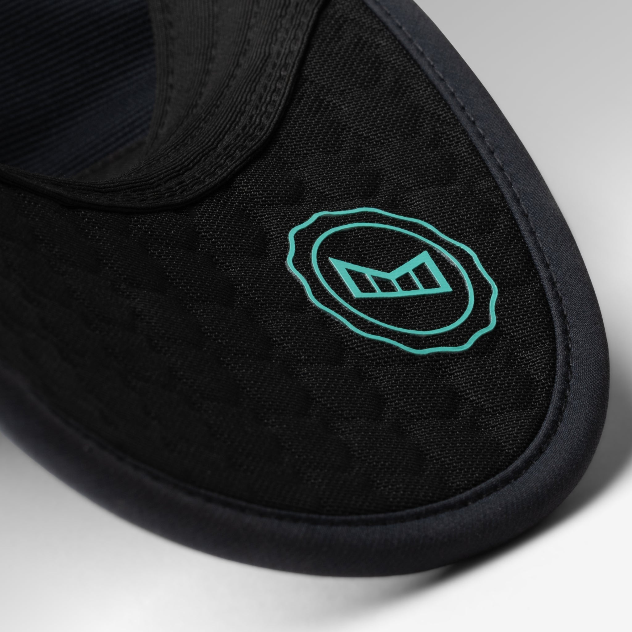 The lifestyle image of the melin Split Fit Odysea W.I.N. Hydro hat in black