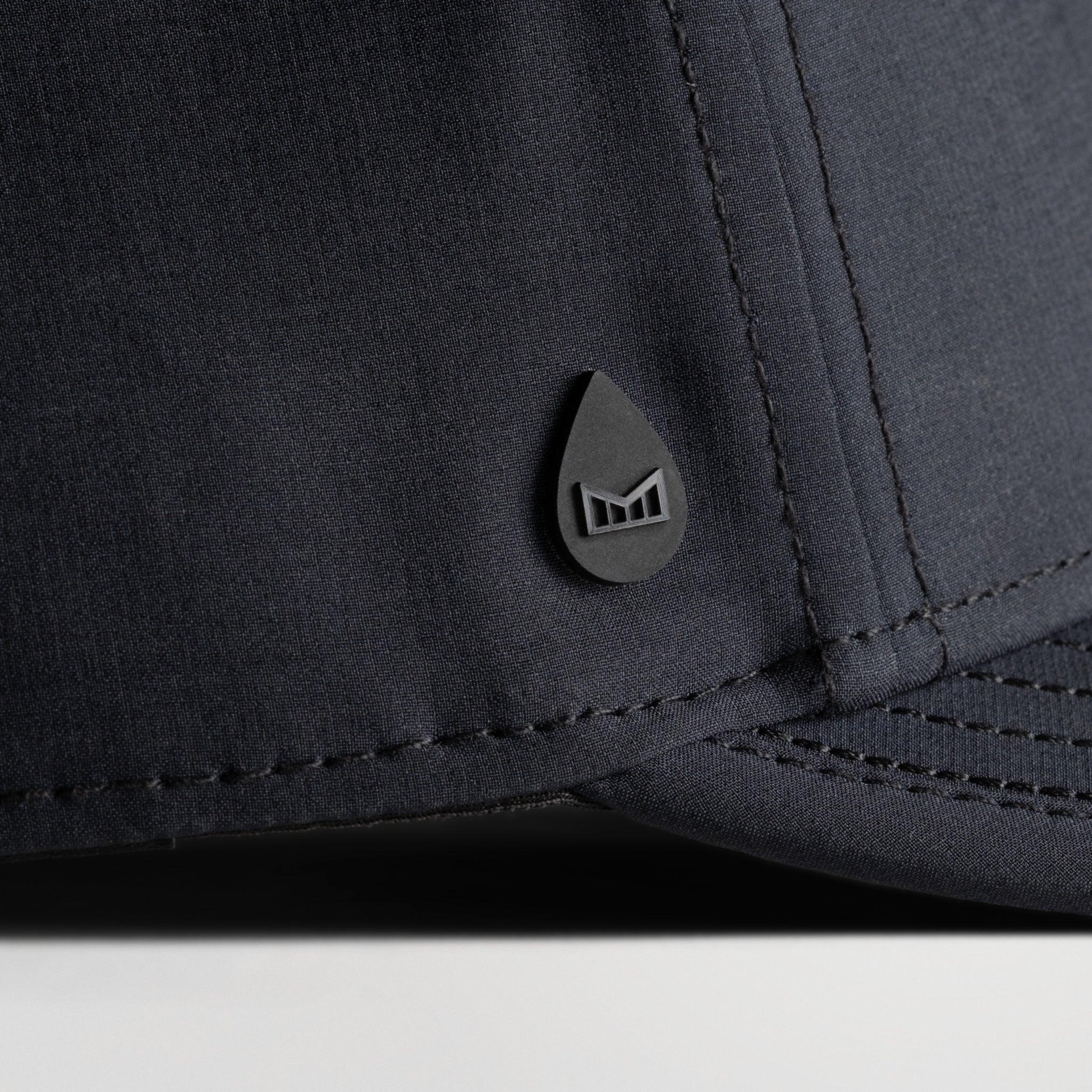The lifestyle image of the melin Split Fit Odysea W.I.N. Hydro hat in black