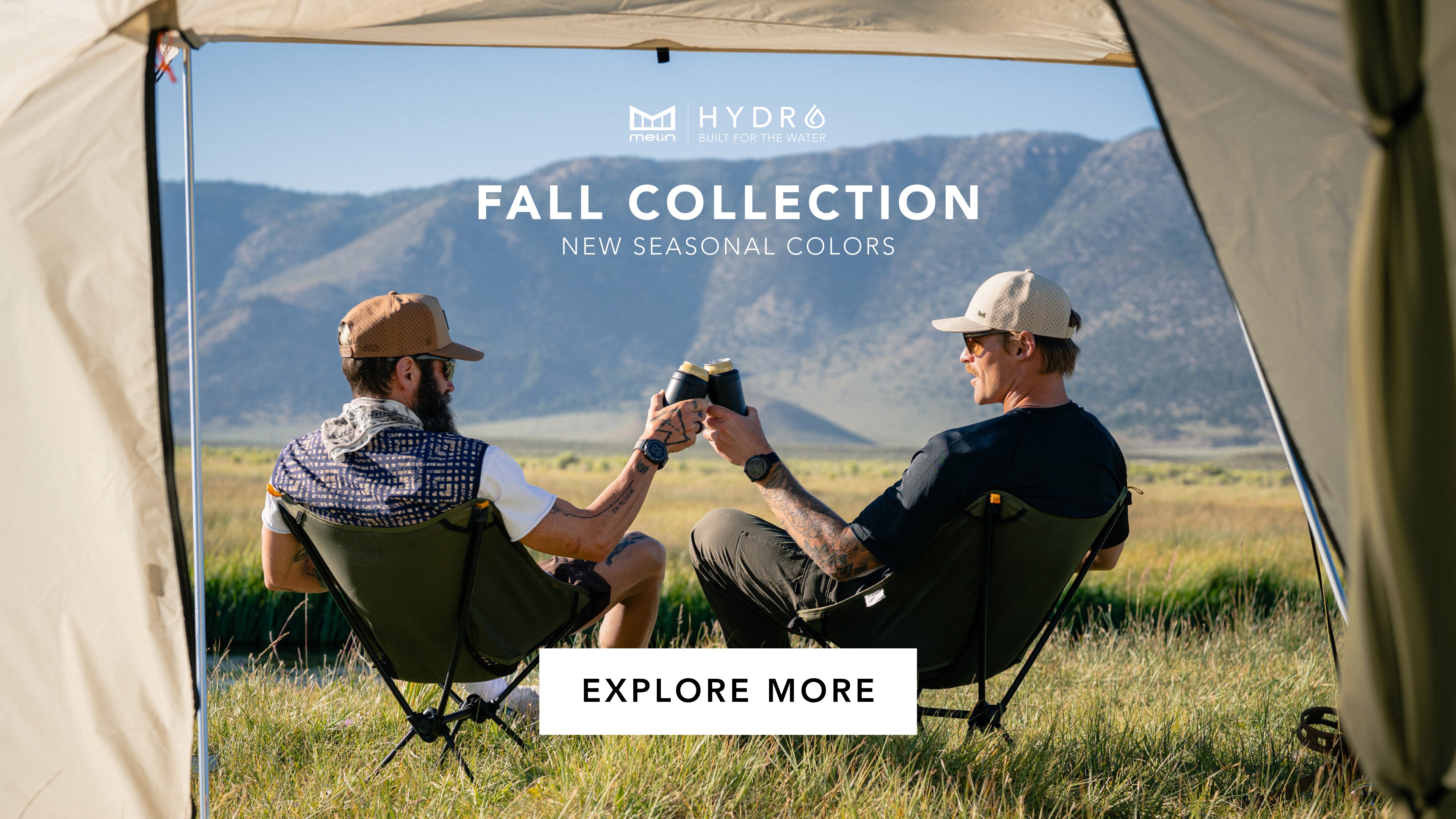 Two people sitting inside a tent with mountains in the background, promoting melin Hydro fall collection.