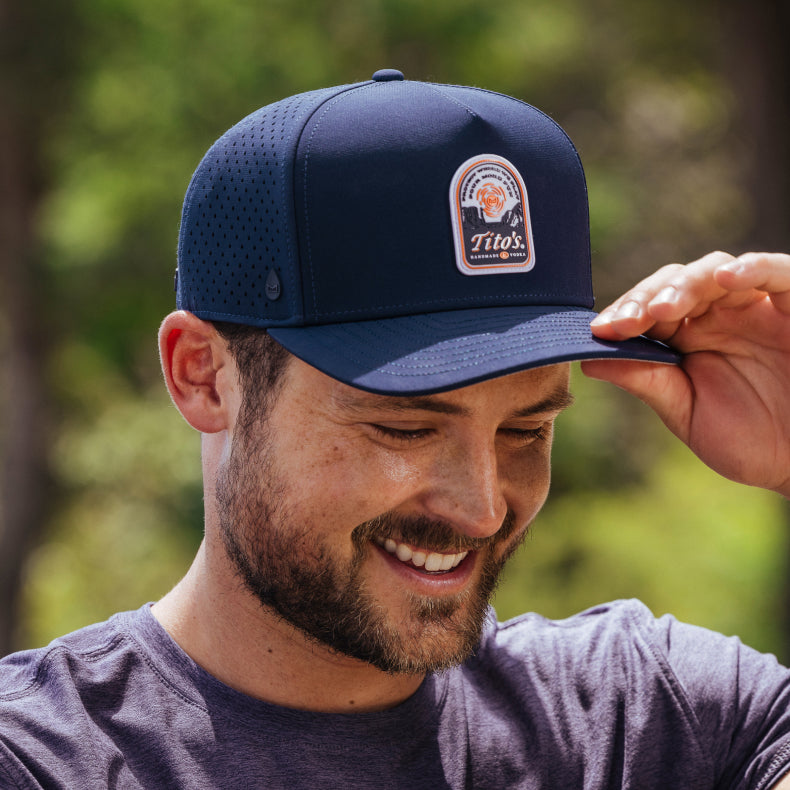 Dylan Efron wearing the melin x Tito's hat