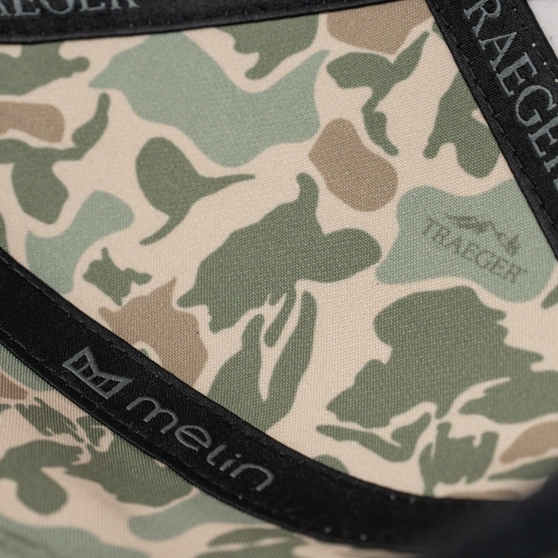 Camouflage-patterned product with 'melin' and 'Traeger' branding.