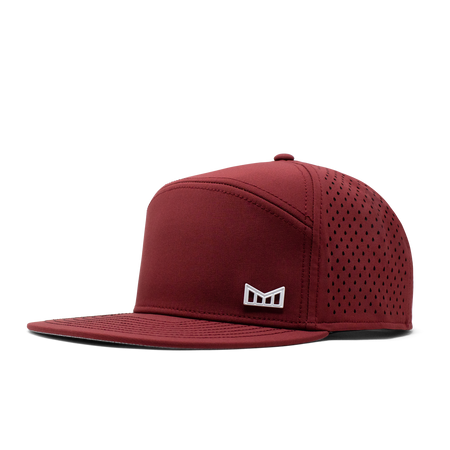 The angled view of the Melin Horizon Fit Trenches Icon Hydro hat in maroon