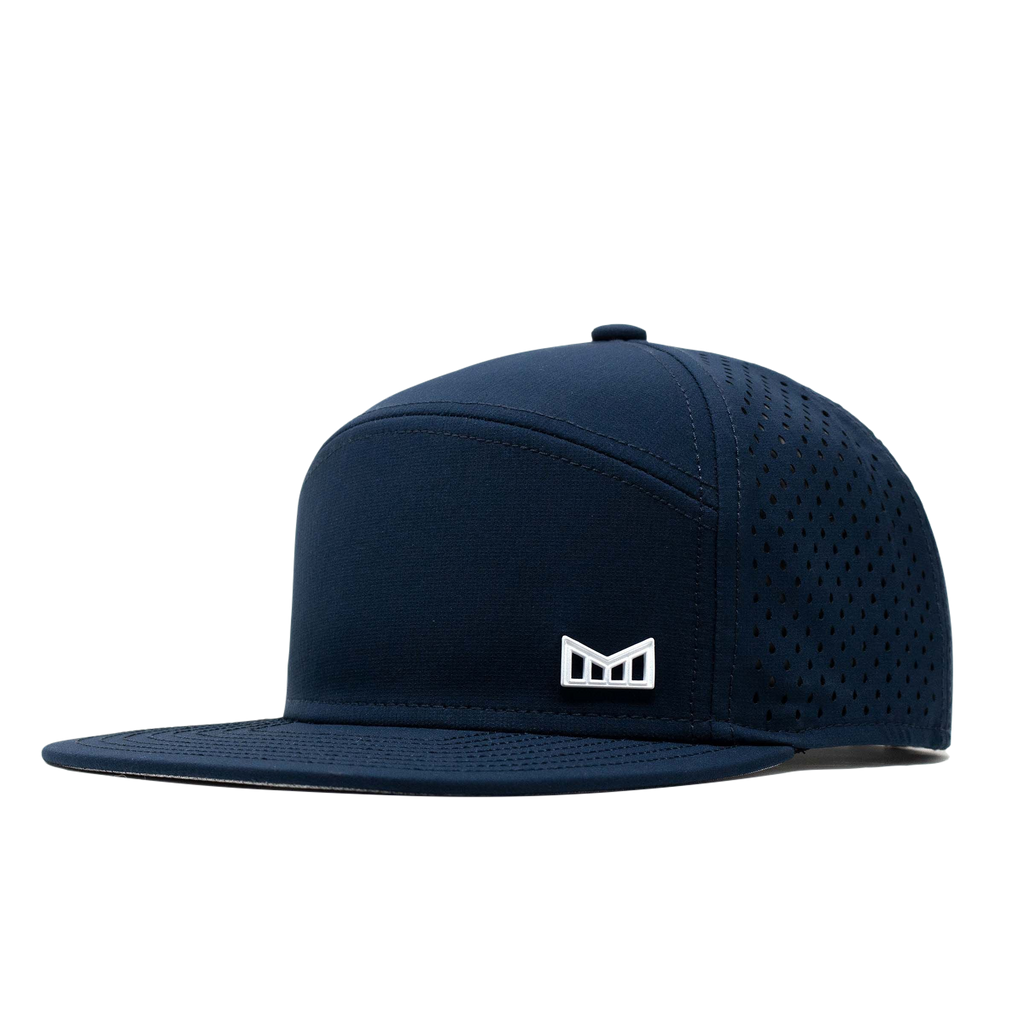 The angled view of the Melin Horizon Fit Treches Icon Hydro hat in dark blue Big Image - 1