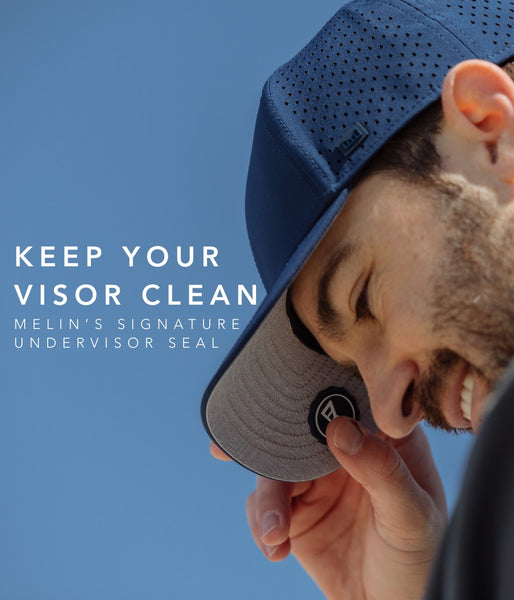 melin undervisor seal on blue a game hat grabbing the bill